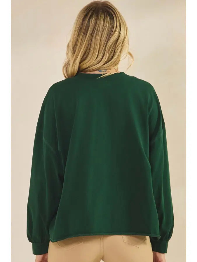 Back of forest green long sleeve cotton top