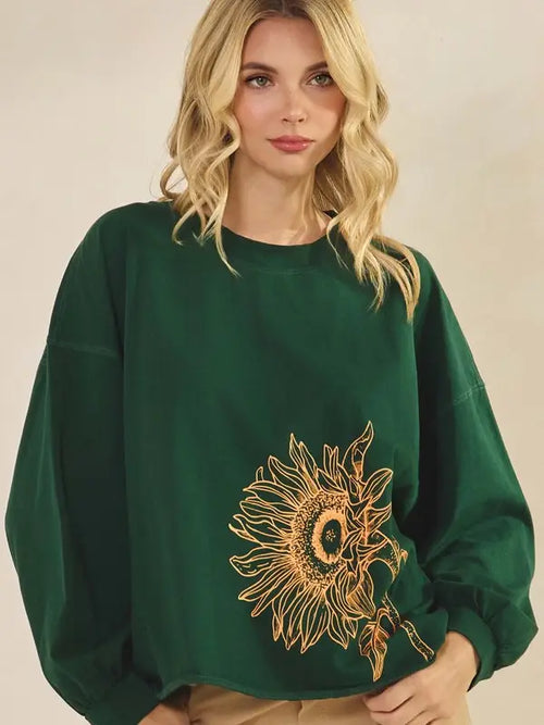 Forest green long sleeve cotton top with sunflower graphic on front